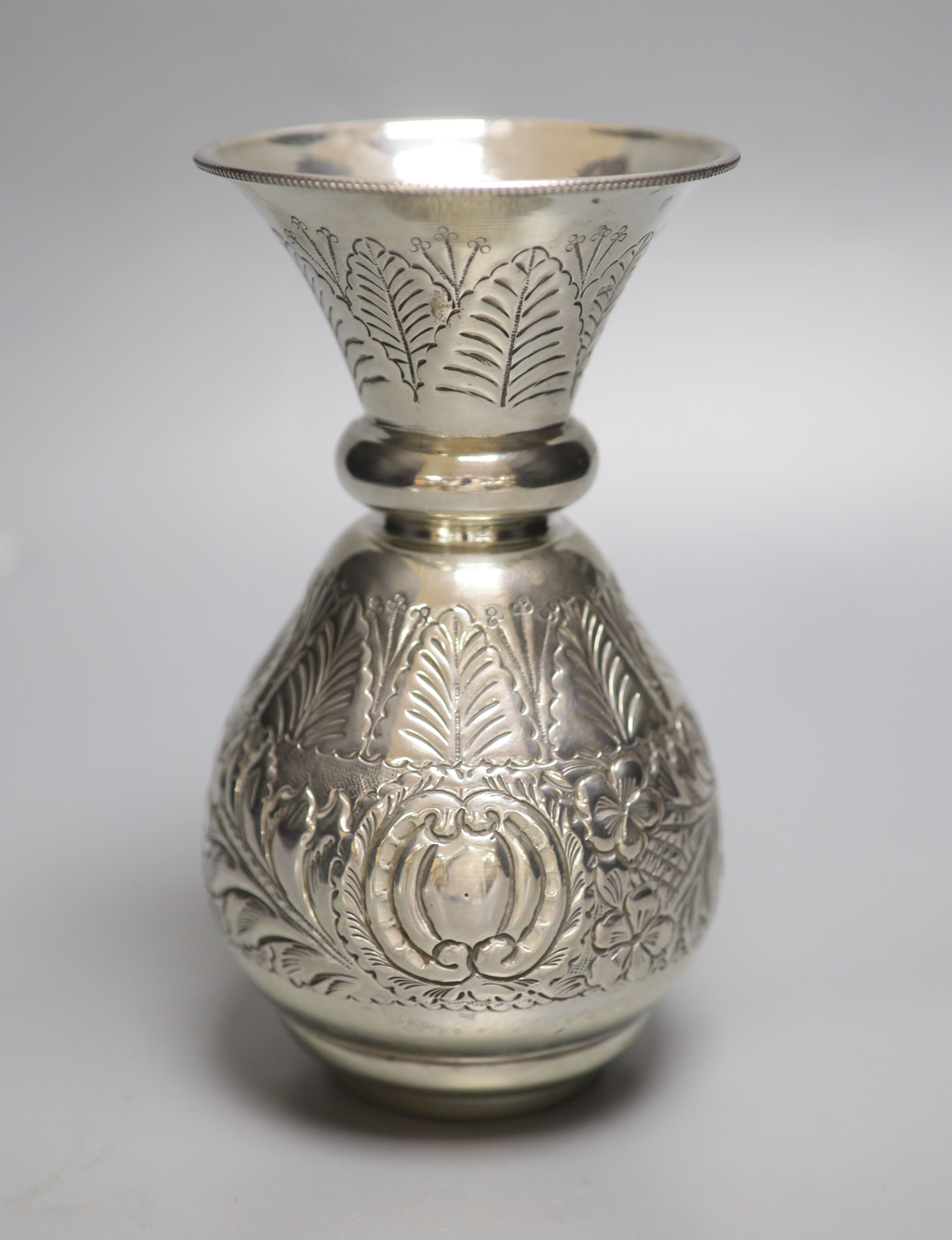 A post 1946 Egyptian embossed white metal baluster vase, 17.5cm,